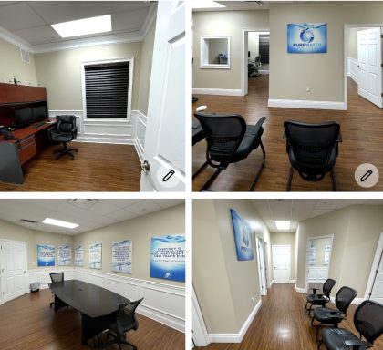 Modern office interior with a meeting room, reception area, and hallway.